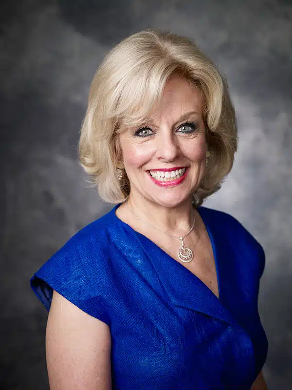 Sandi Chapman Headshot blue dress