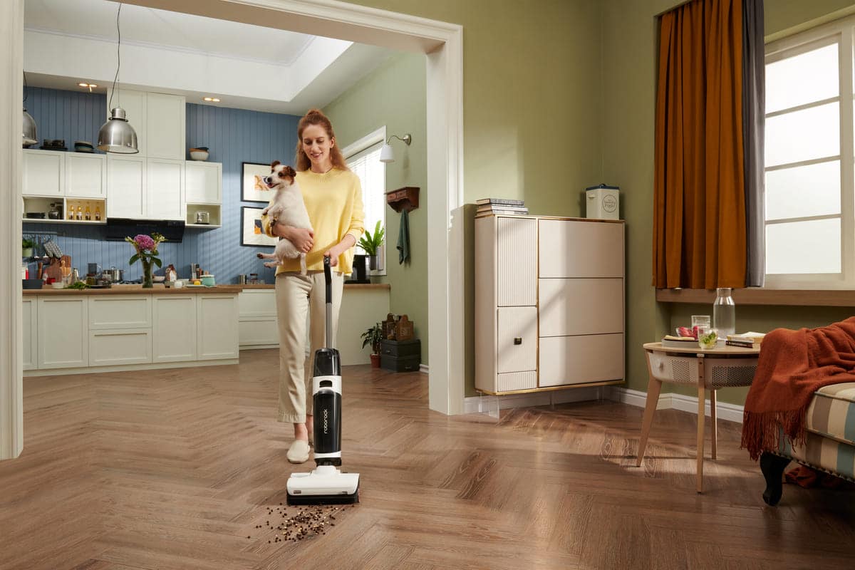 Woman and dog cleaning with dyad pro