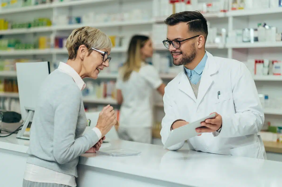 Woman talking to pharmacist