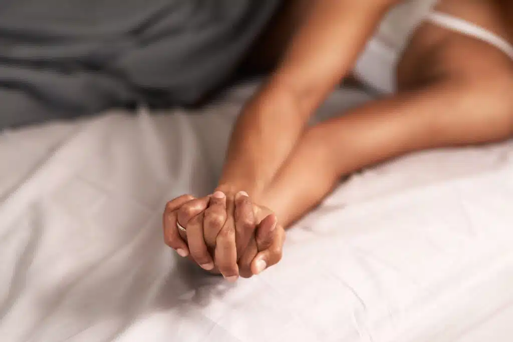 Couple in bed making love; sex drive, libido