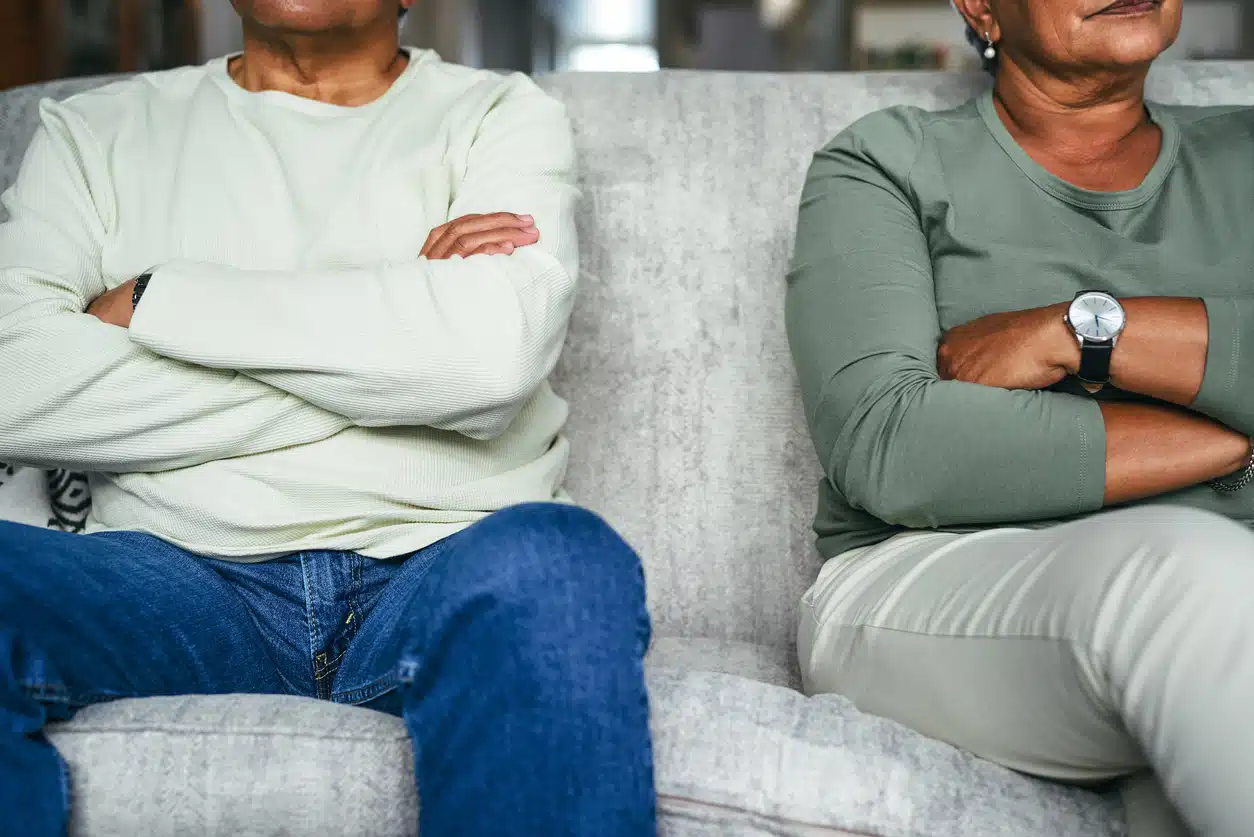 Shot of a senior couple having a disagreement at home; Cheating feature