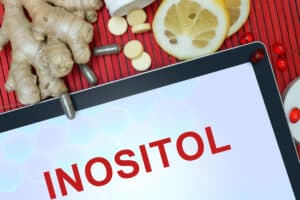 Tablet with words Inositol. Healthy eating.