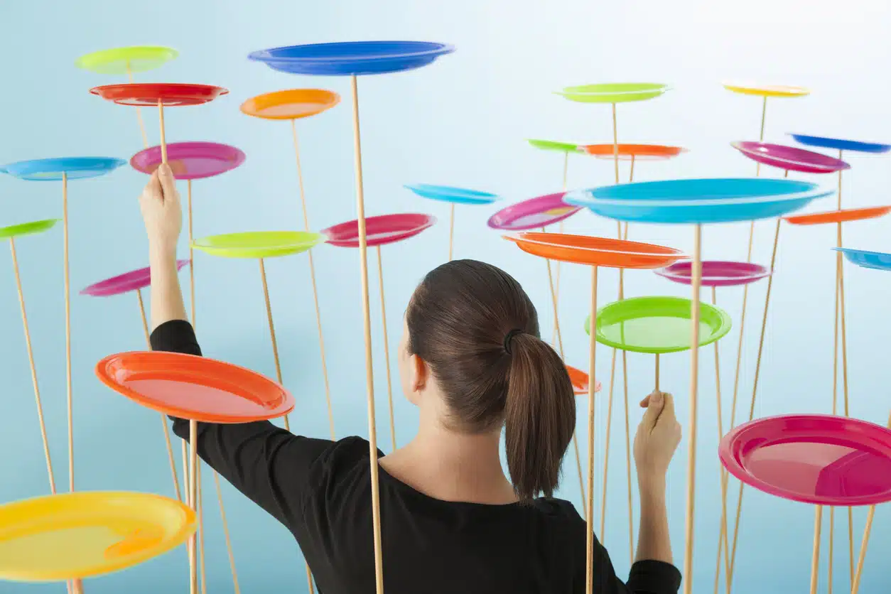 Multitasking; woman juggling too many things; overwhelmed