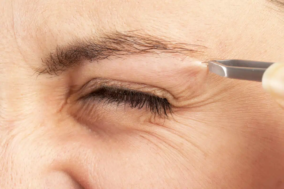 plucking or tweezing eyebrows