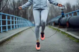 Woman jumping rope; cardio workout; fall workout; exercise