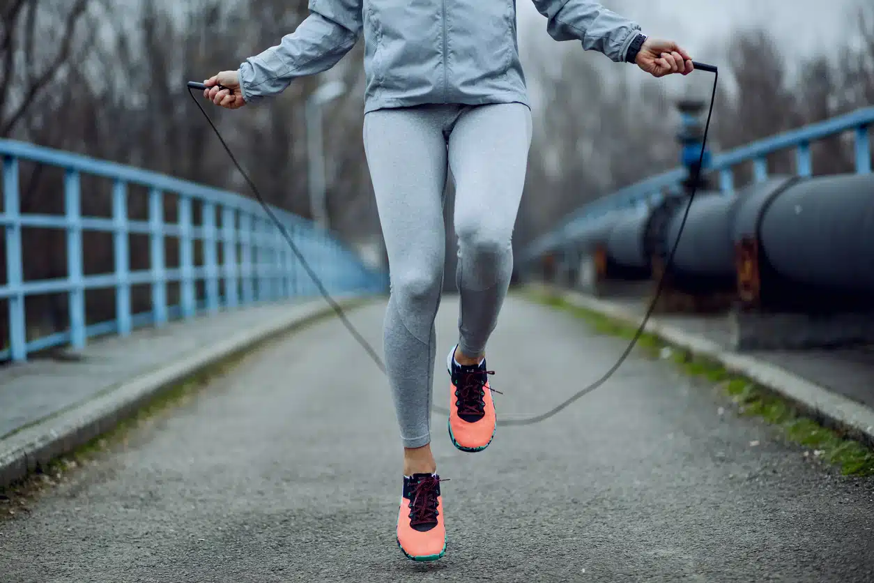 Woman jumping rope; cardio workout; fall workout; exercise