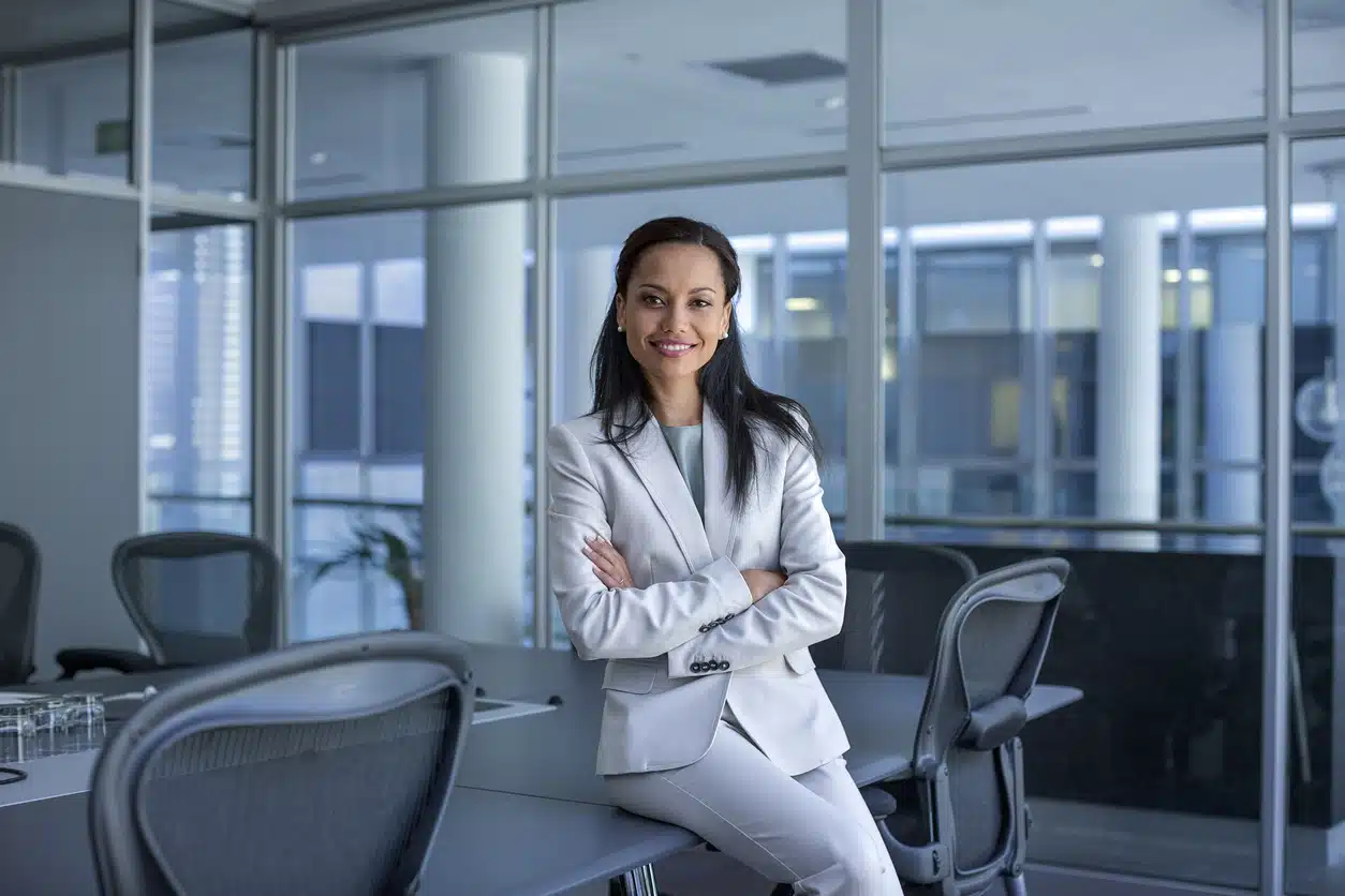 Woman wearing a trouser suit in her office