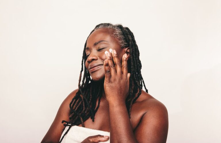 Woman putting product on her face
