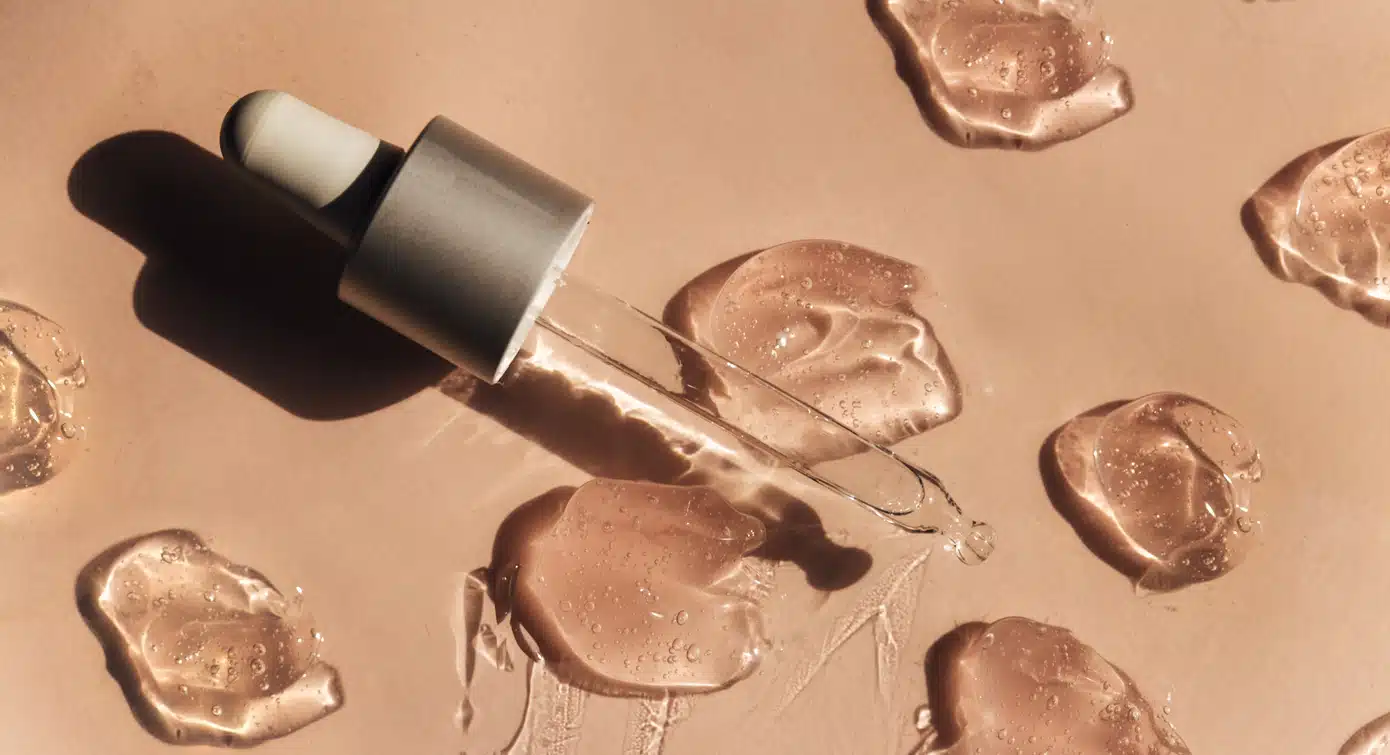 Beauty serum gel texture. Clear skincare cream with bubbles background