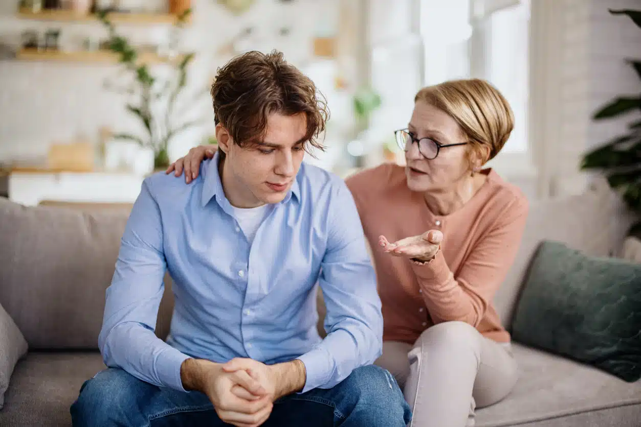 Mother gave her son a consoling pat on the back