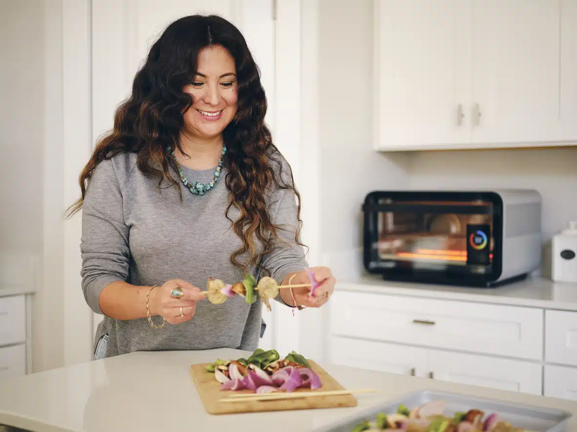 Woman Preparing Kebabs in a Kitchen