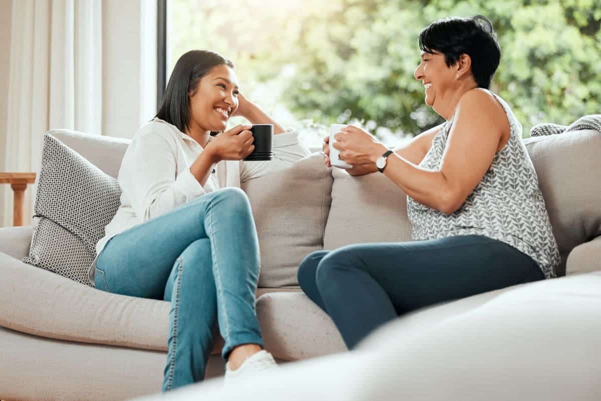 mother and daughter having coffee