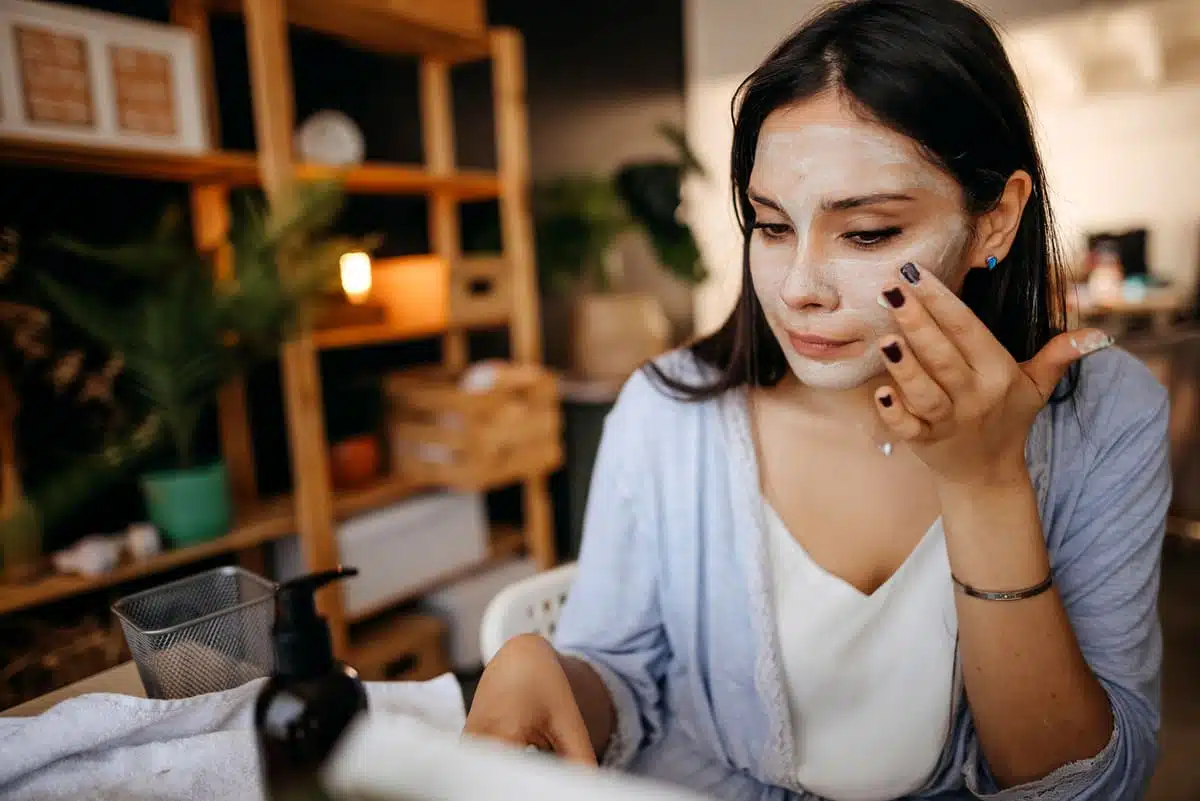 woman applying face mask
