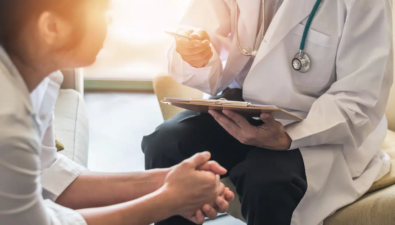 Woman talking to doctor