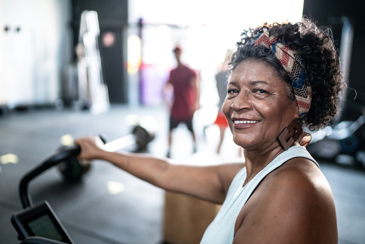 Portrait of senior woman doing exercise in a gym