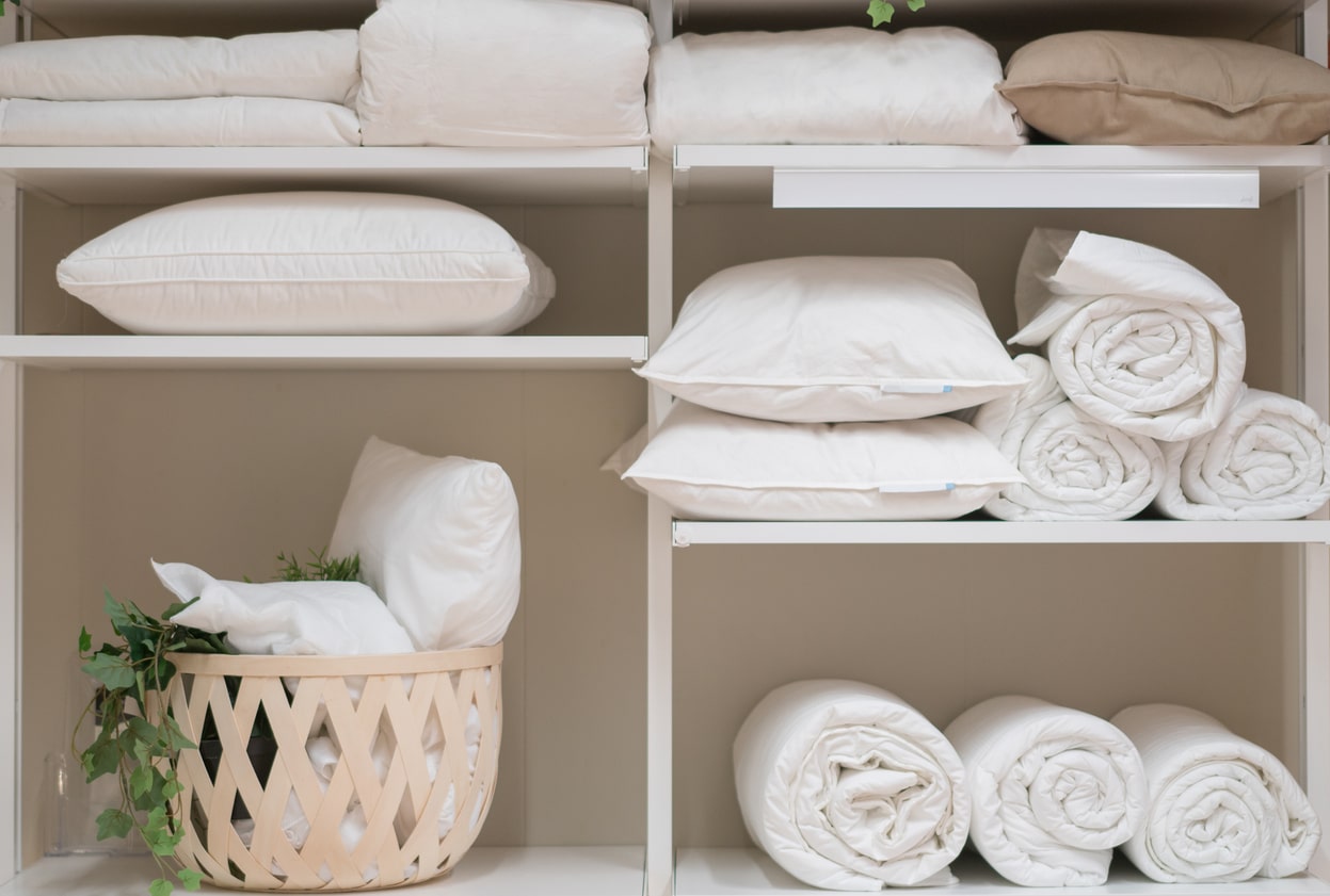 clean towels folded in linen closet
