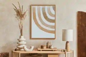 Stylish living room interior design with console and mock up poster frame. Lamp, vase and elegant personal accessories.