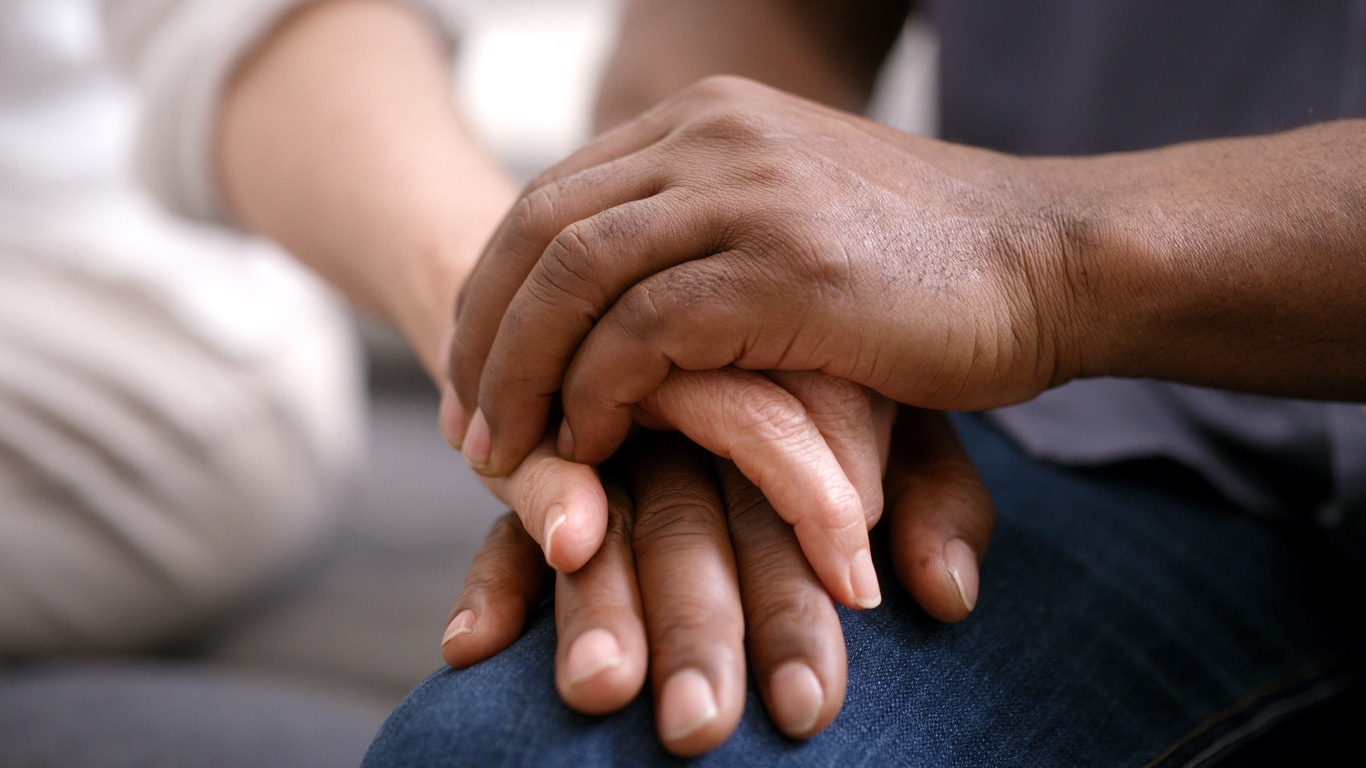 Support, help and couple holding hands for hope, empathy and love in marriage therapy. Security, trust and man and woman with solidarity, kindness and gratitude in counseling with care and respect