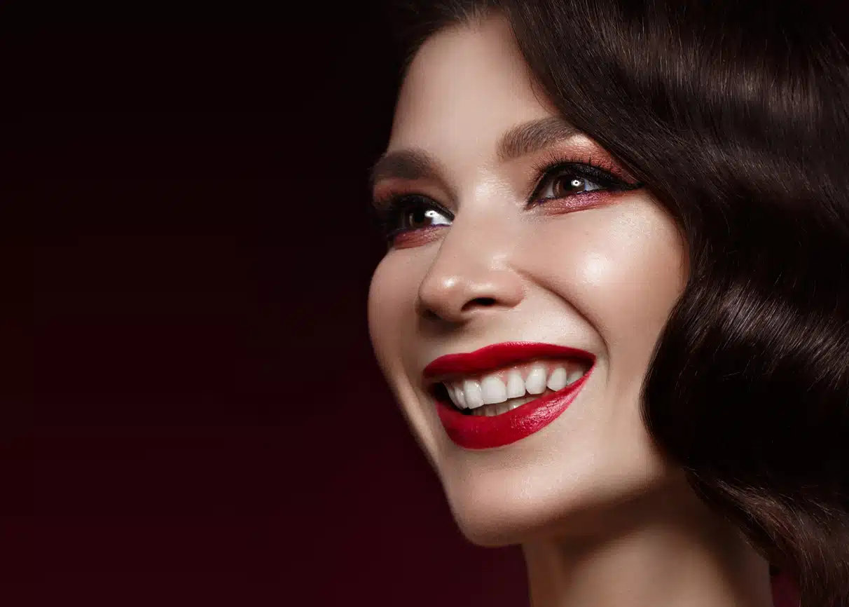 beautiful girl in Hollywood image with wave hair and classic makeup. Beauty face. Photo taken in the studio.