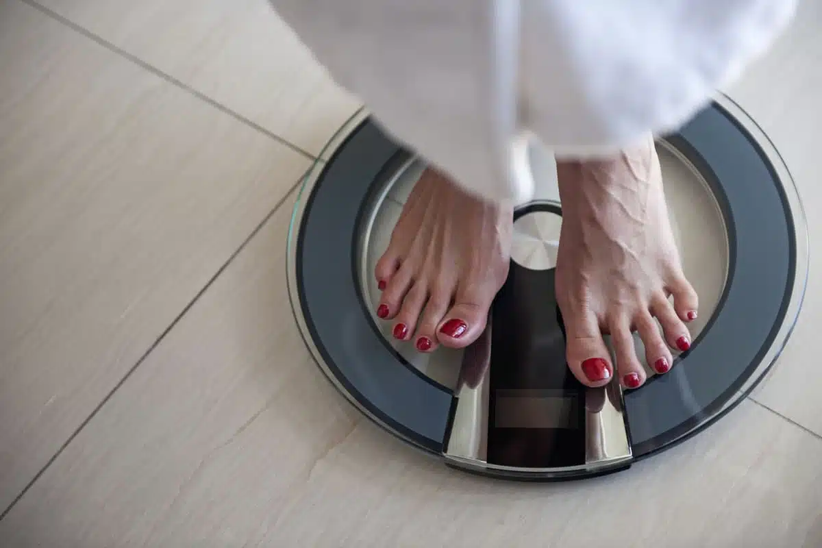 Woman standing on a scale