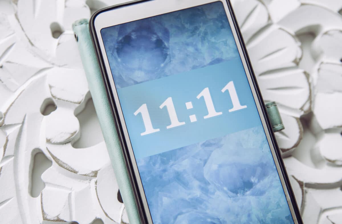 Person looking and seeing similar numbers. Seeing same similar numbers is called Angel numbers. Angels sending cryptic messages and communicating concept.