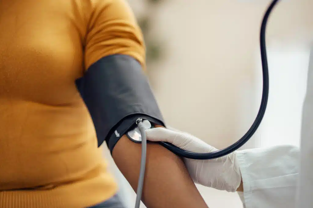 Measuring blood pressure with blood pressure manometer, sphygmomanometer.