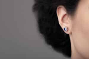 Woman with earrings; permanent earring