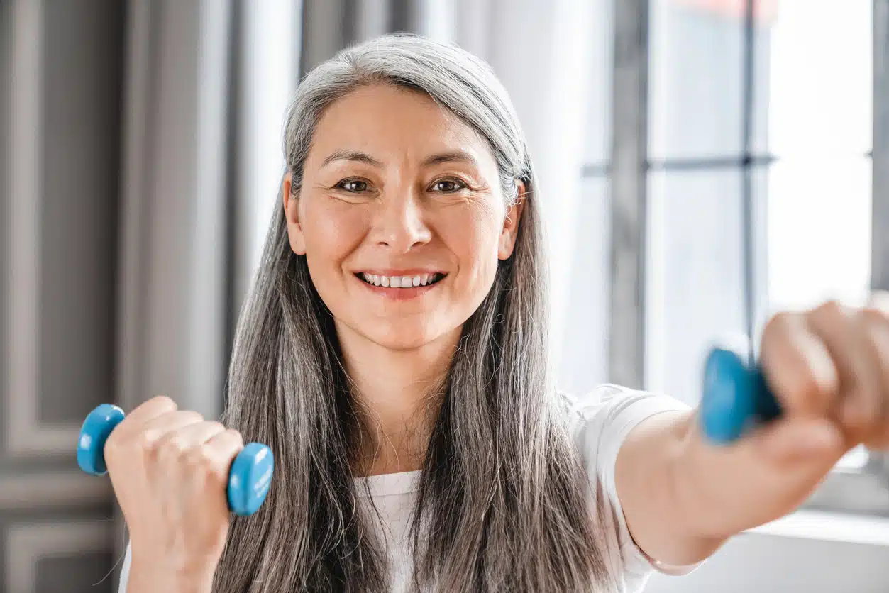 Weight training, woman lifting weights, dumbbells