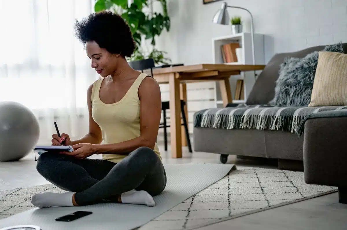 woman journaling on the floor
