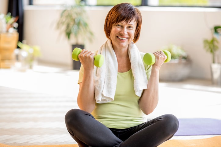 Woman lifting dumbbells