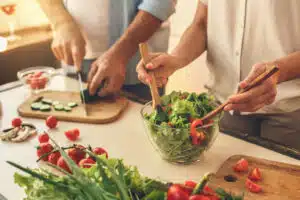 Senior couple cooking together at home meal preparation