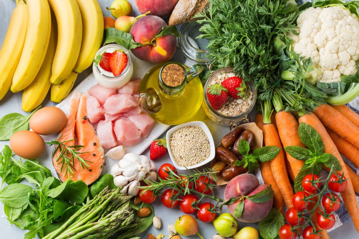 Balanced nutrition concept for DASH clean eating flexitarian mediterranean diet to stop hypertension and low blood pressure. Assortment of healthy food ingredients for cooking on a kitchen table.