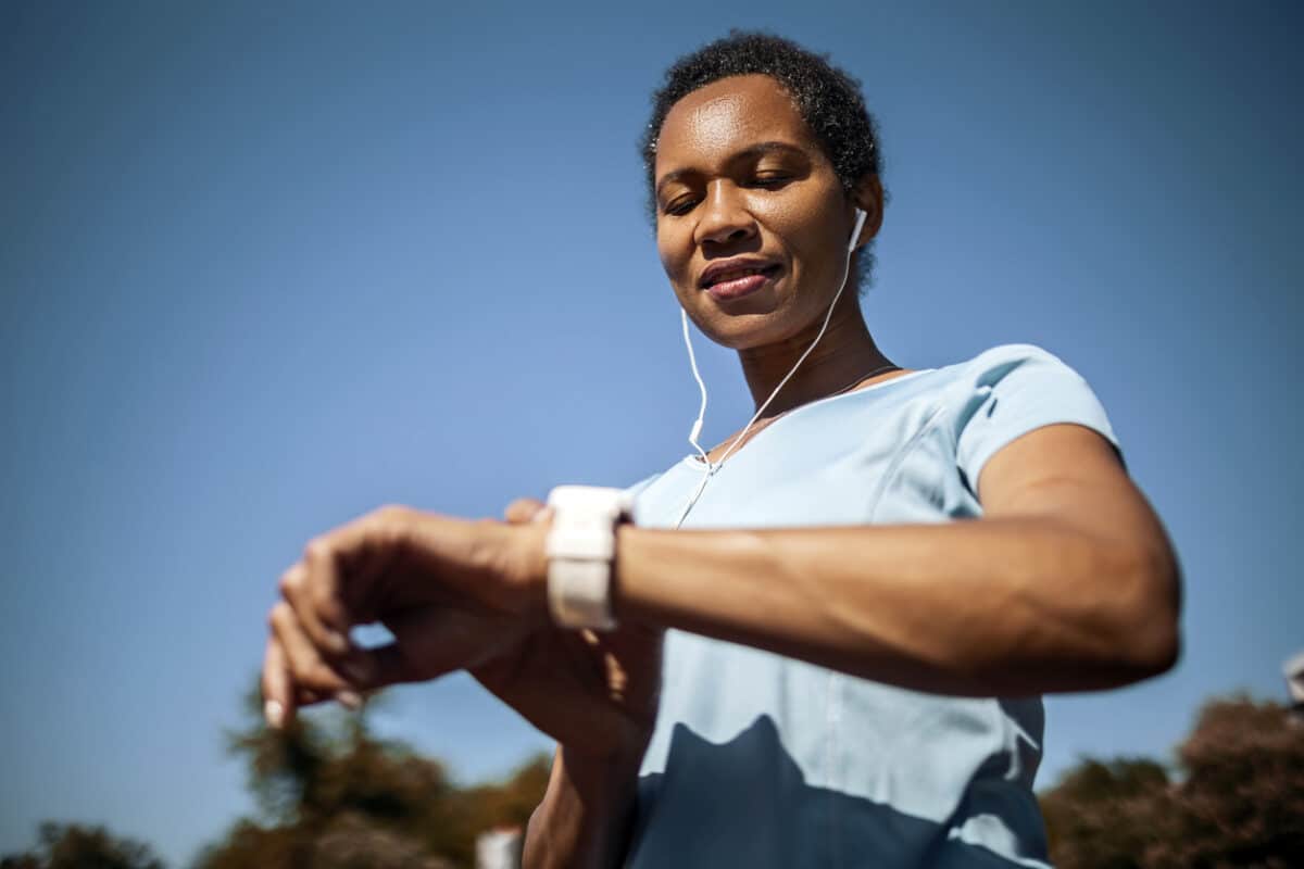 Woman checking heart rate after sports training