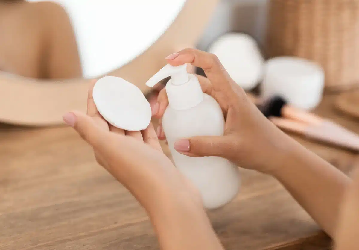 Putting facewash on cotton pad