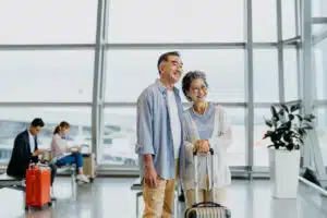 Older couple at the airport; tips for traveling with an elderly person