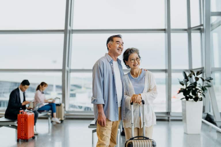 Older couple at the airport; tips for traveling with an elderly person