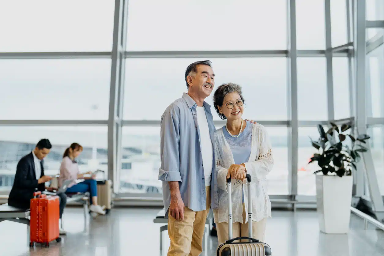 Older couple at the airport; tips for traveling with an elderly person