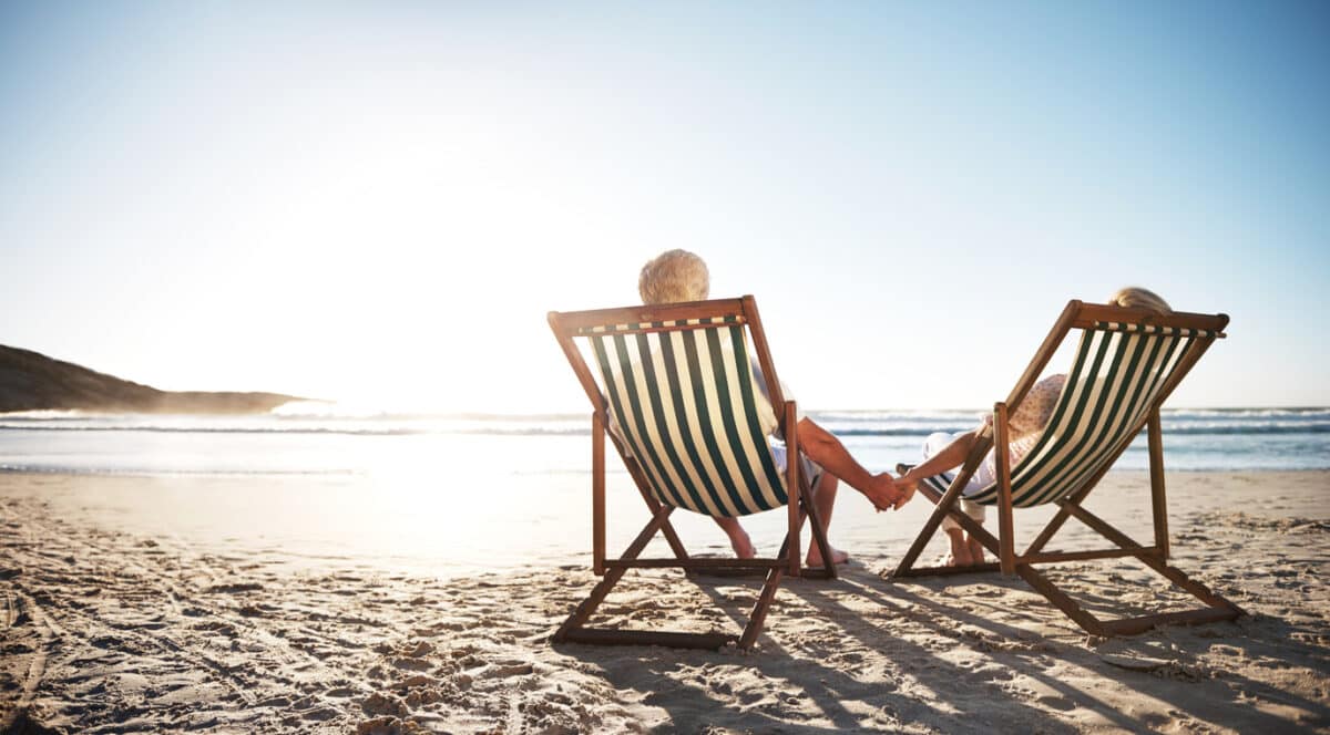 Couple on the beach holding hands