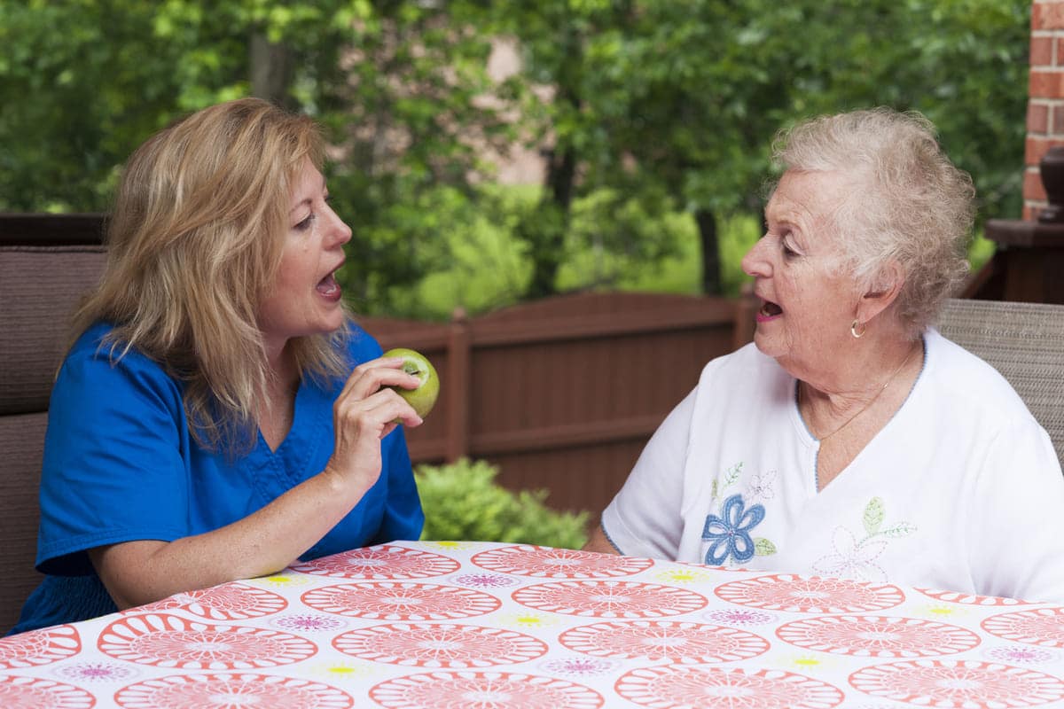 speech pathologist working with aphasia patient