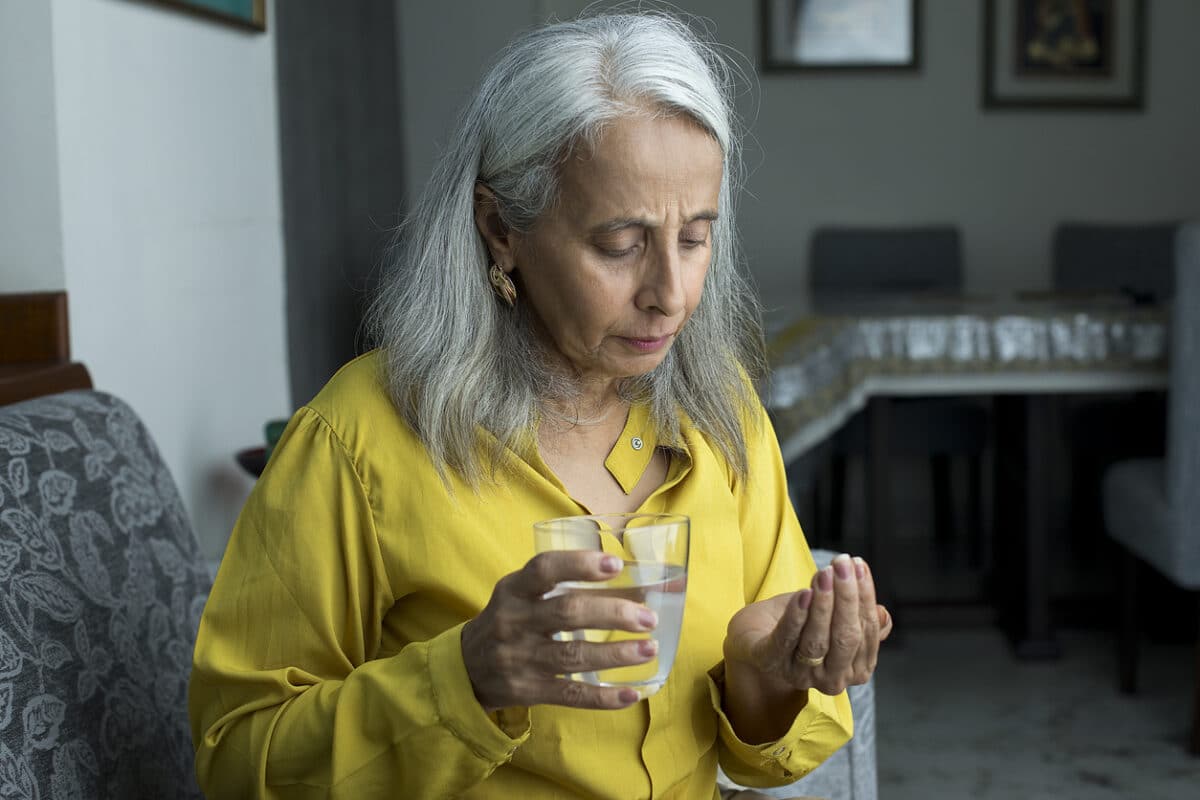 Woman taking a pill
