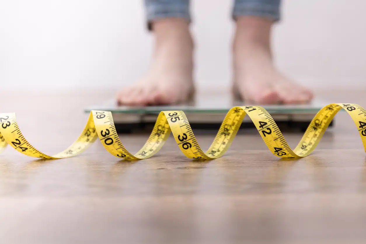 Lumen metabolic weight management; weight loss, woman on a scale