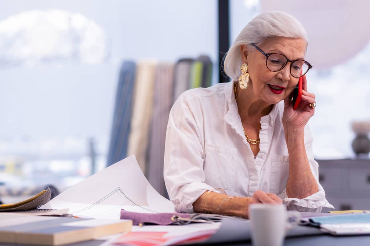 Older woman working at her office