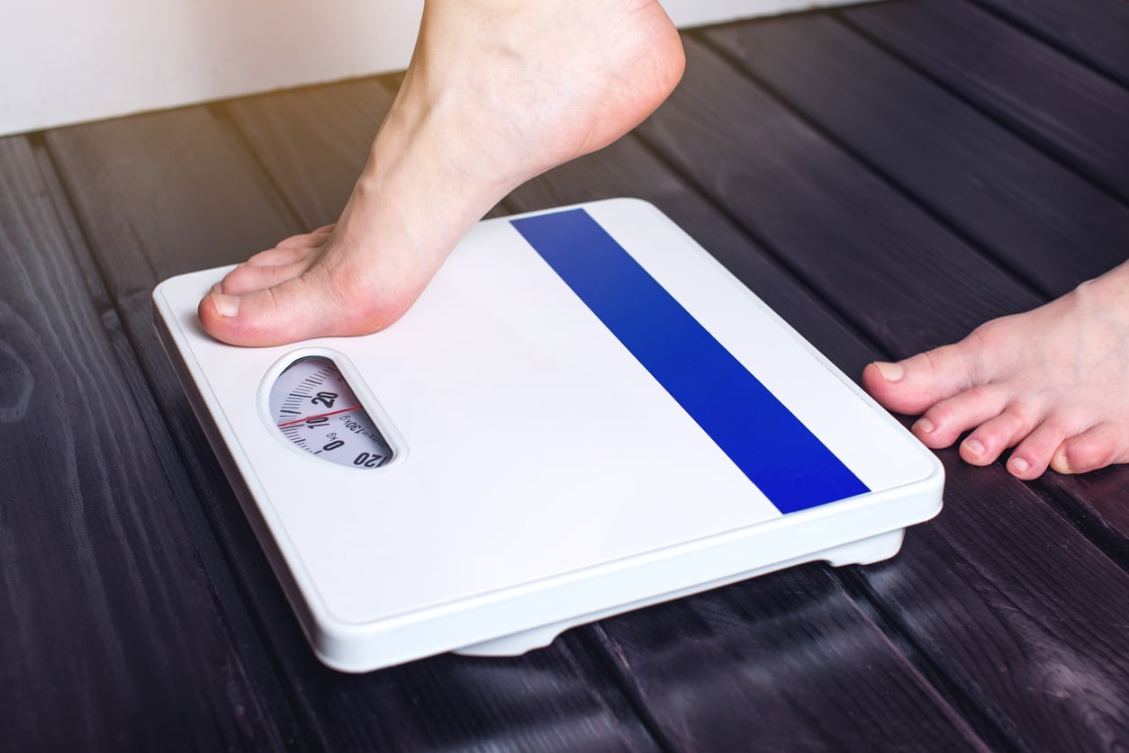 Feet on scale or weight loss