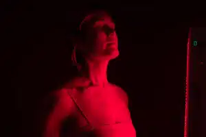 Woman getting red light therapy from a red light device; LED Masks