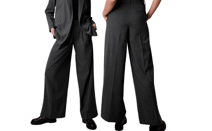 2 cropped women wearing heather pants