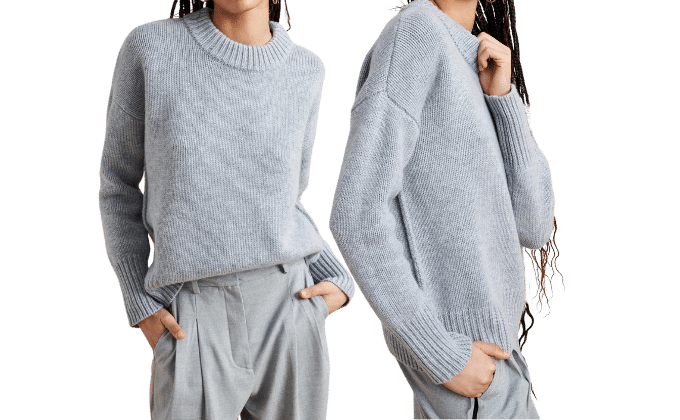 2 cropped women wearing sweater