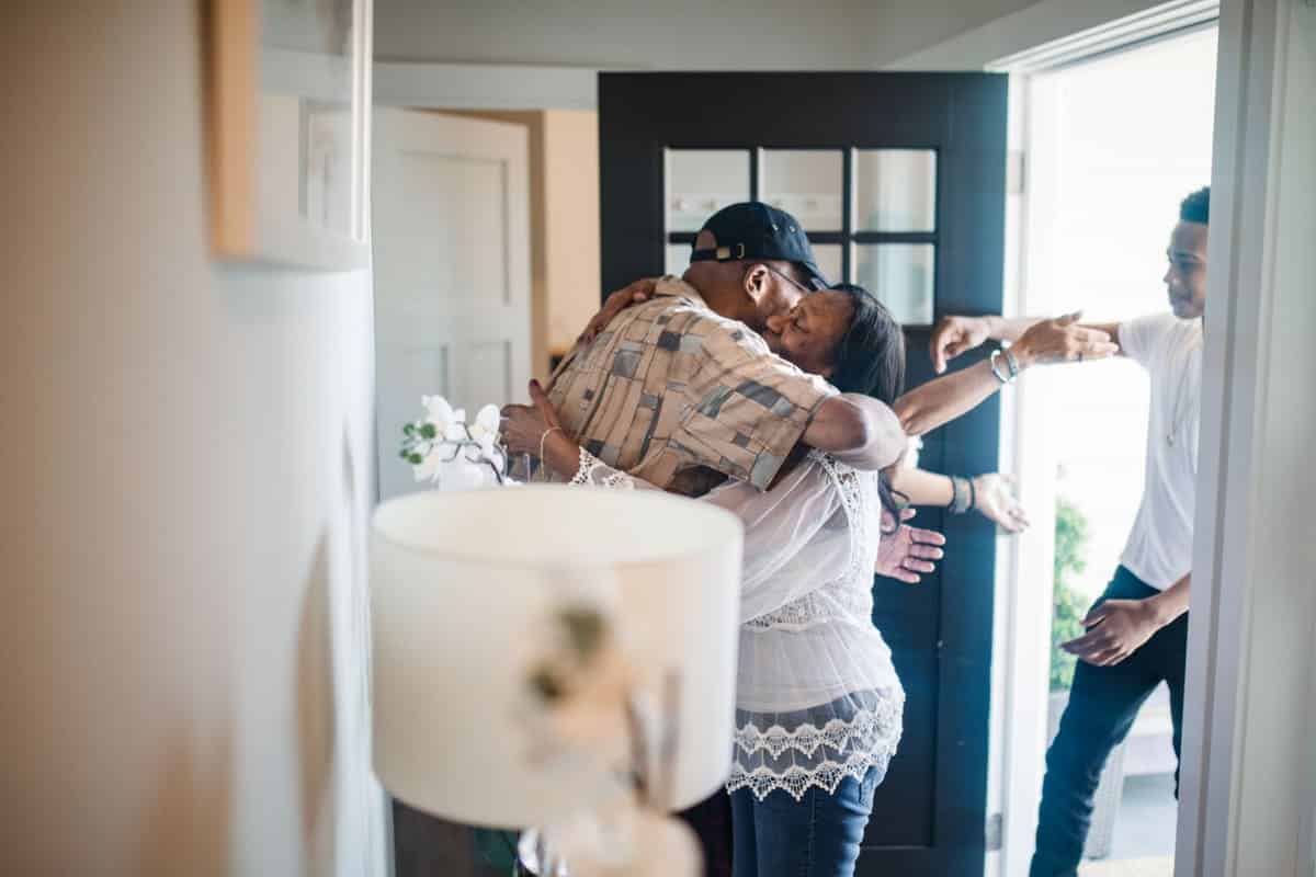 family reuniting, hug