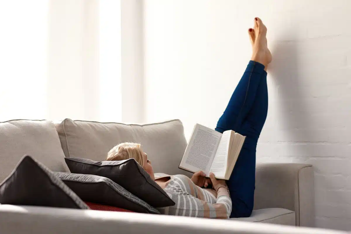less stress, woman reading a book relaxing