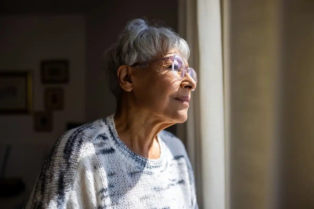 woman looking out the window