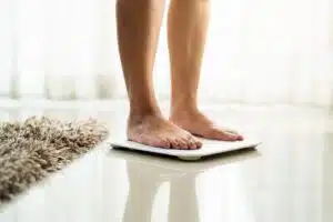 Weight loss, person on a scale